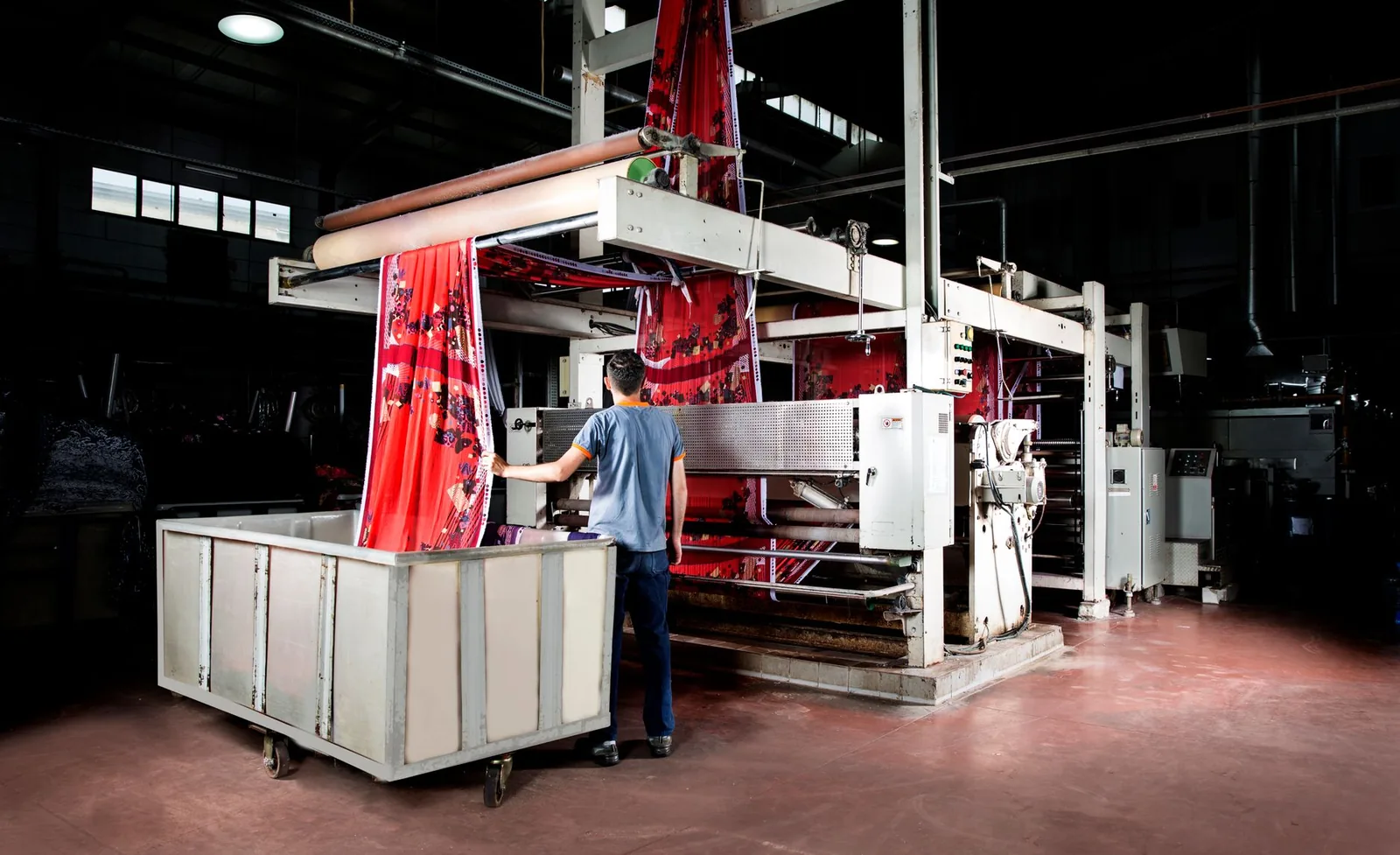 Worker operating machinery in a manufacturing facility