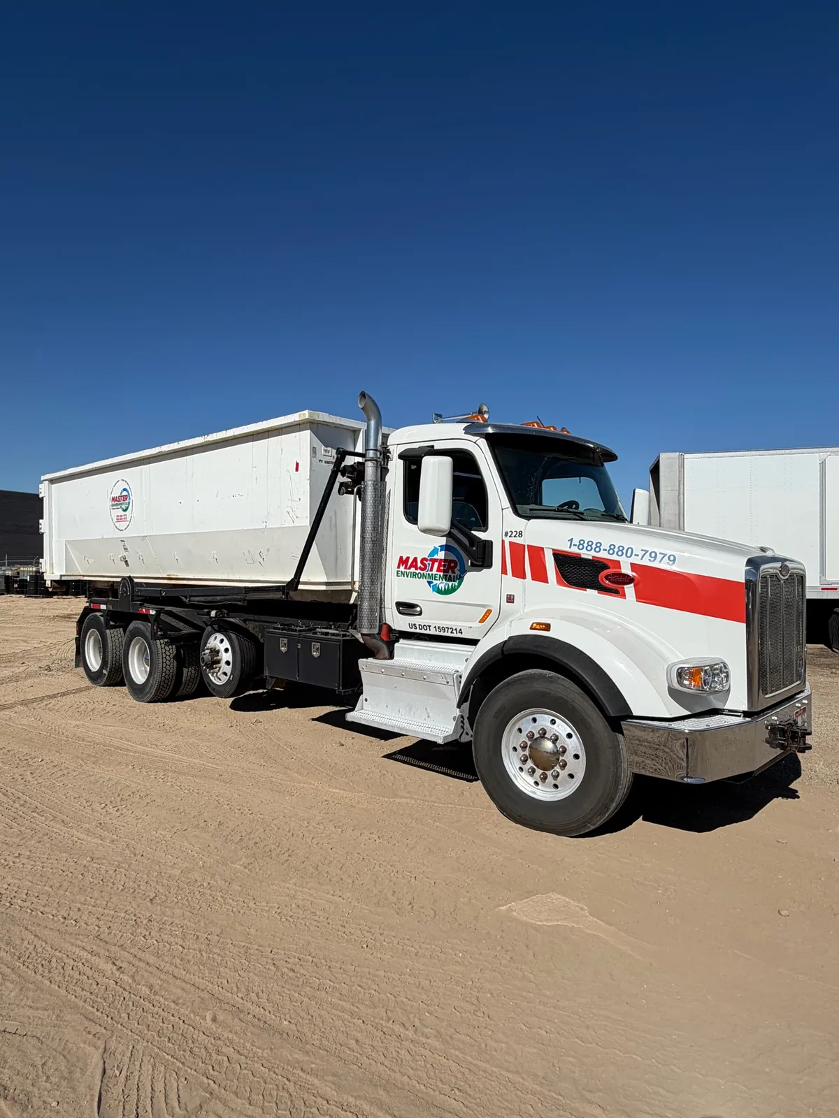 Master Environmental roll-off truck ready for commercial and industrial container service