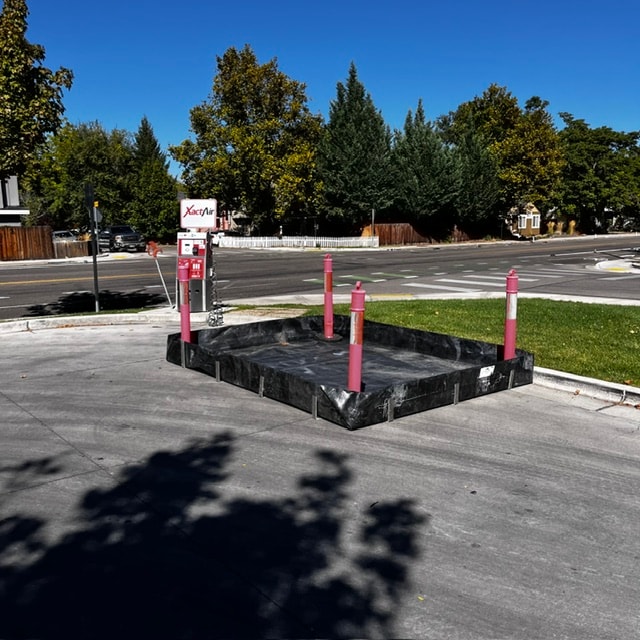 Secondary containment installed around a fuel dispensing area